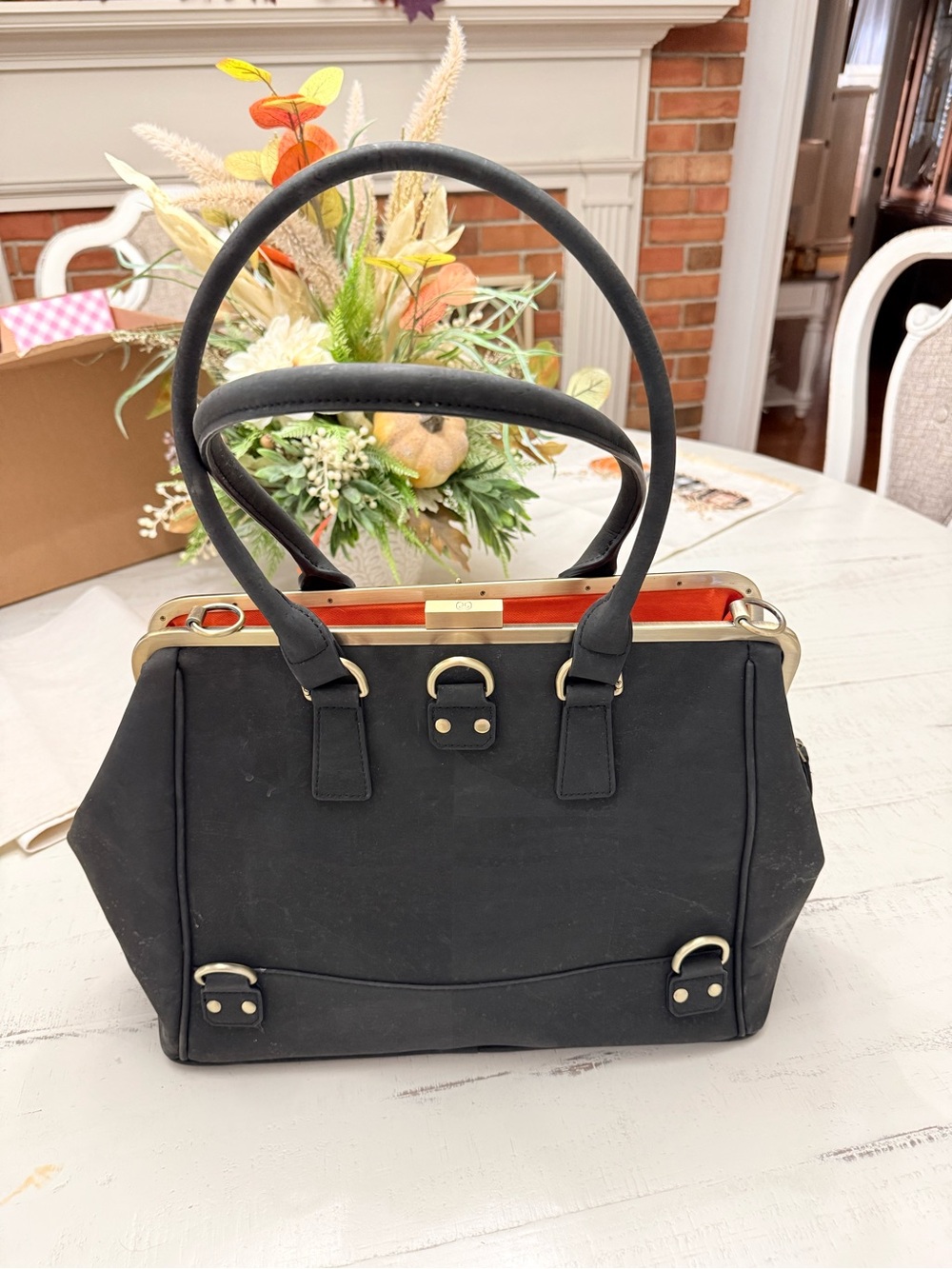 Black Satchel with Gold-Tone Hardware and Orange Interior